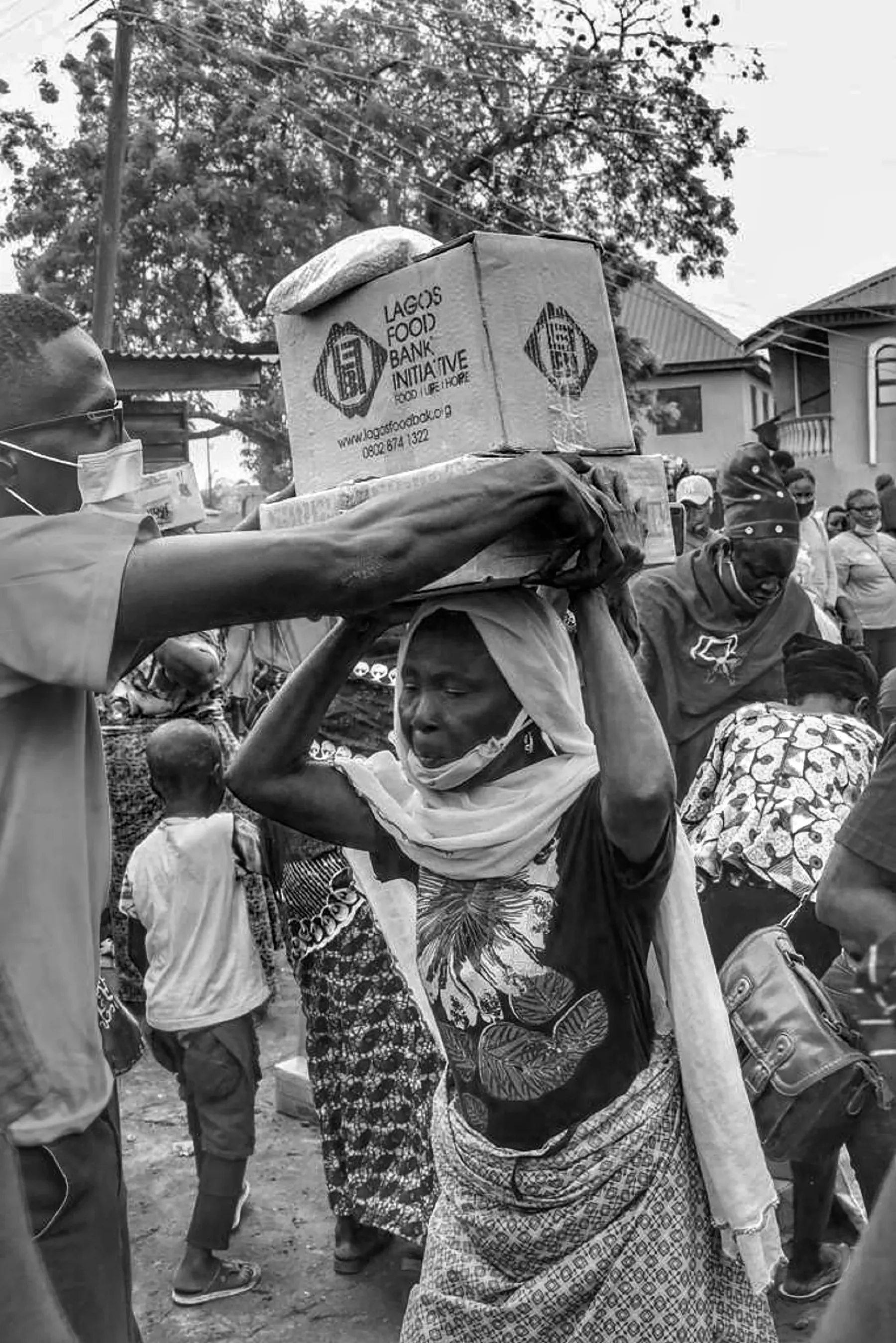 Volunteers preparing food relief supplies in a community setting